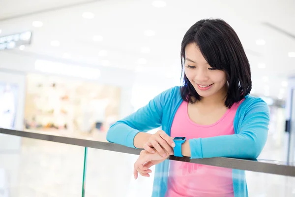 Asian woman using smart watch
