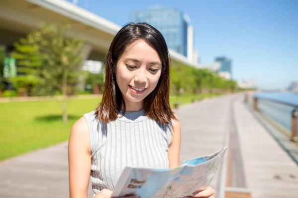 Woman using city map in Hong Kong