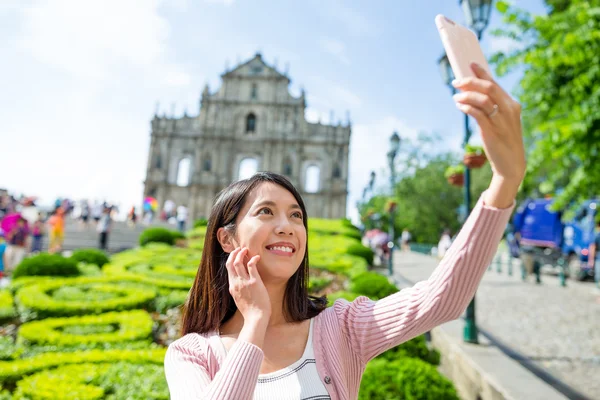 Woman taking photo by smart phone