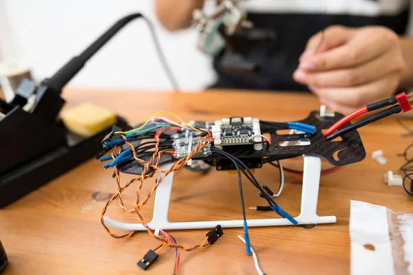 Man doing repair of drone