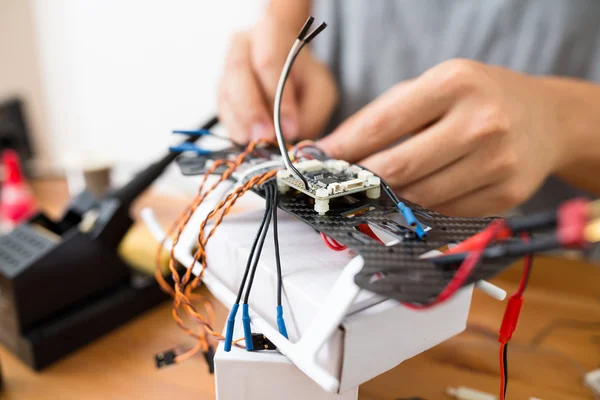 Installation of drone on table close up