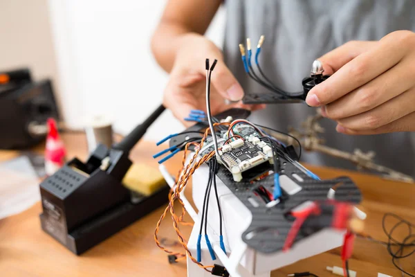 Connecting the cable of drone