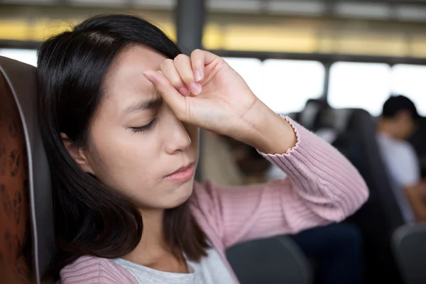 Woman suffering from headache on the ferry