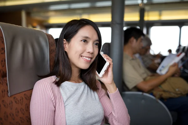 Woman talking on cellphone on the ferry