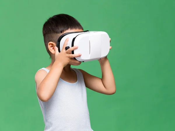 Little boy with virtual reality headset