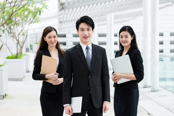 Asian business people in business suits