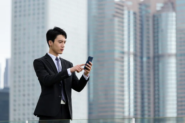 Asian businessman in business suit at outdoor