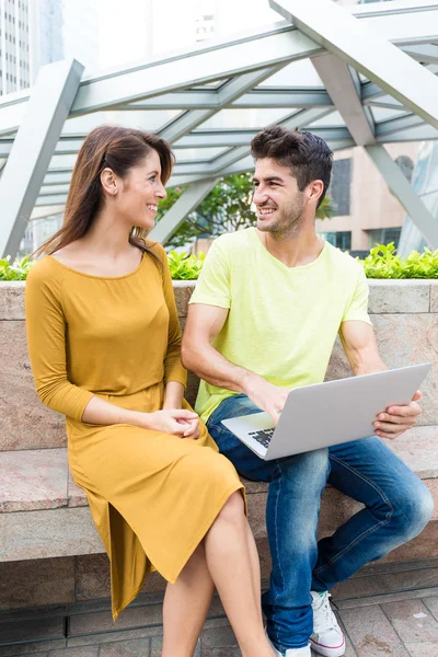 Couple using laptop computer