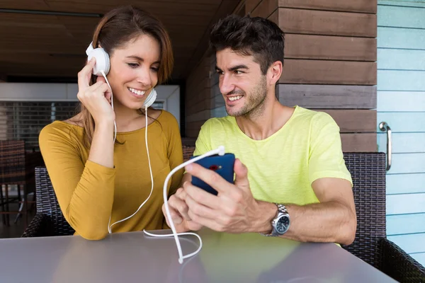 Woman listen to song by mobile phone