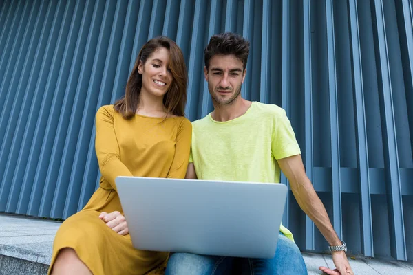 Couple looking at the laptop computer