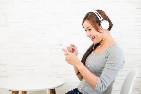 Woman listen to song with music player