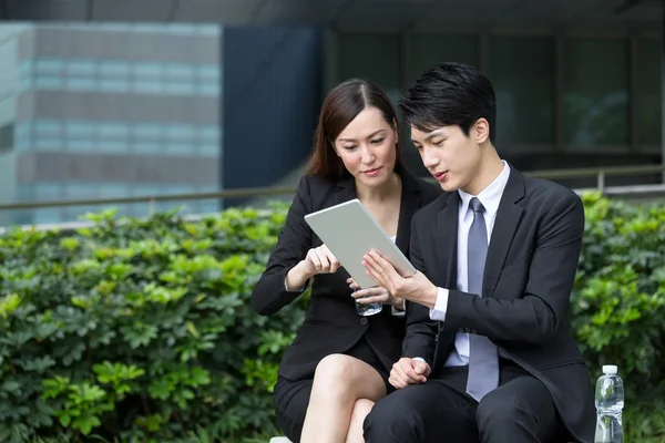 Business people using tablet pc together