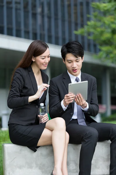 Business people using tablet pc together