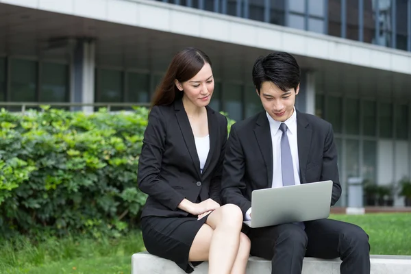 Business people working on laptop computer