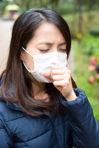 Asian young woman sick and wearing face mask