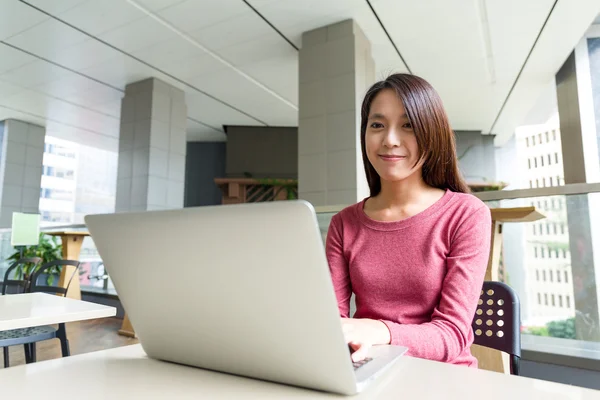 Asian young woman with laptop