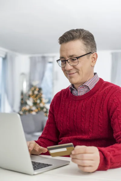 Man using laptop to shop online