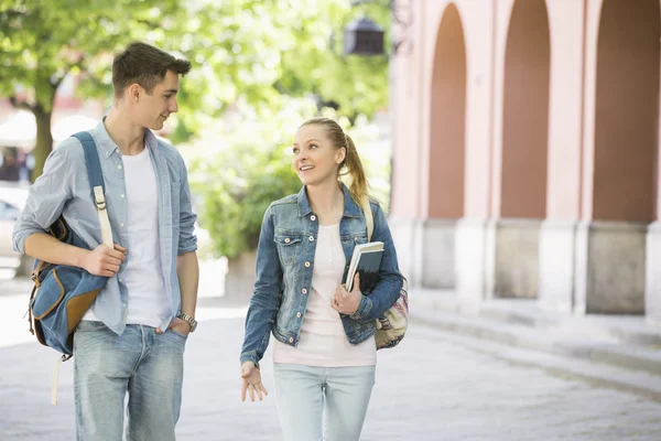 Couple talking while walking