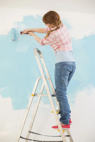 Woman  painting wall