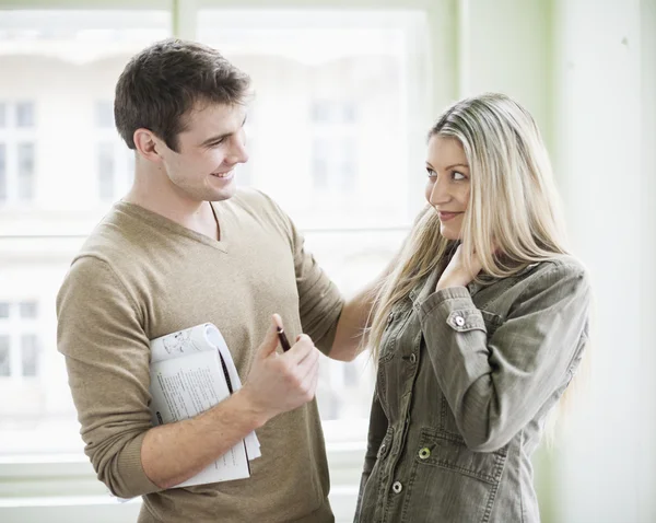 Business couple standing in office