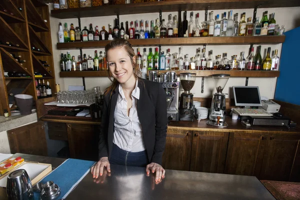 Cashier standing at counter