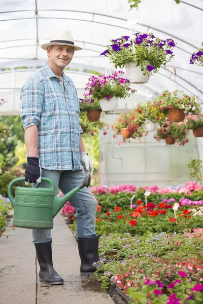 Man carrying watering can