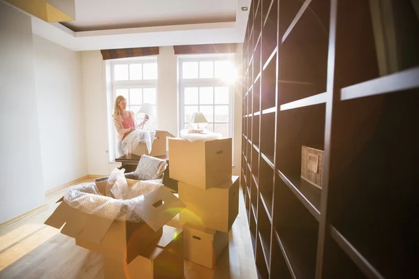 Woman unpacking lamp