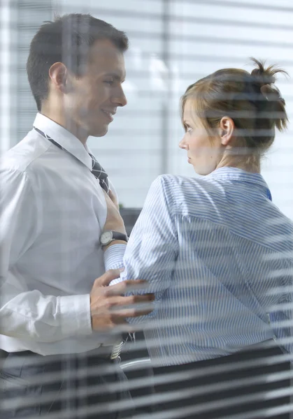 Businesswoman flirting with  colleague