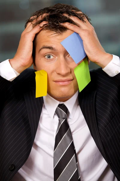 Businessmanwith blank adhesive notes