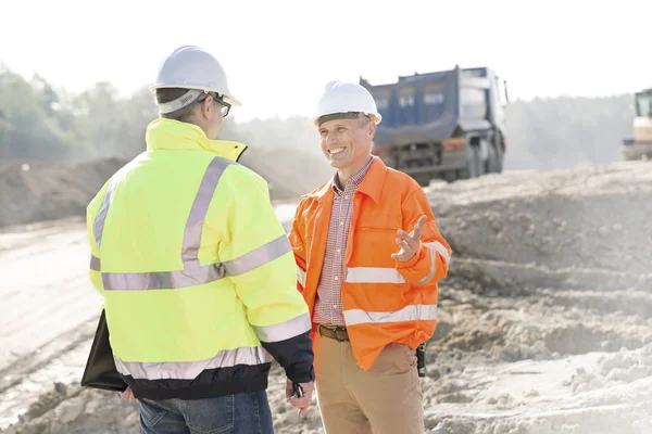 Engineer talking to colleague