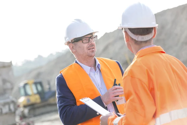 Architects discussing at construction site