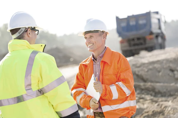 Engineer discussing with colleague