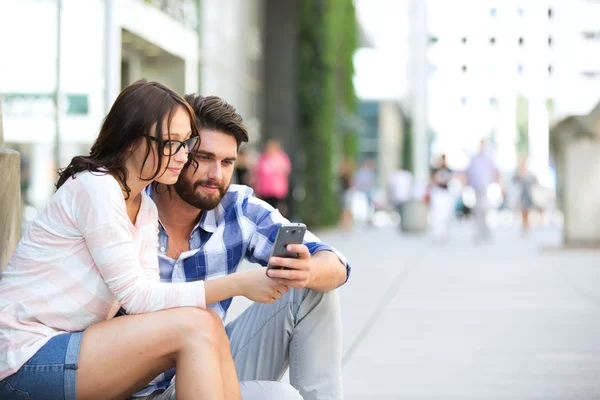 Couple using smart phone