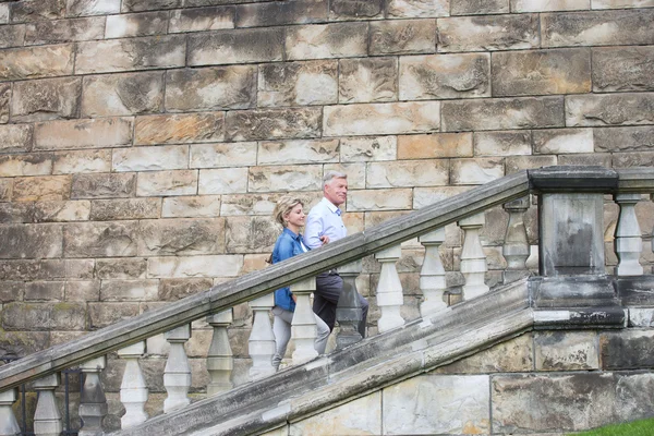 Couple climbing steps