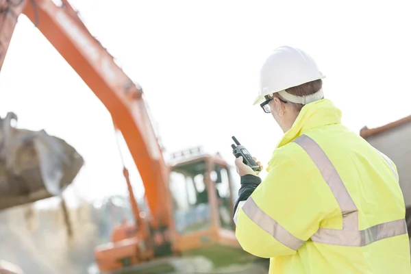 Supervisor using walkie-talkie