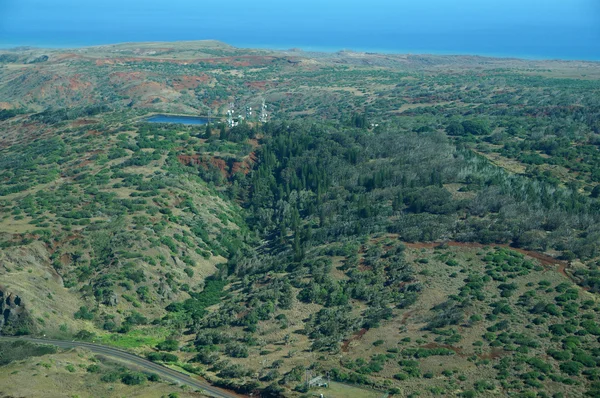 Aerial of countryside running to the ocean with Water reservoir