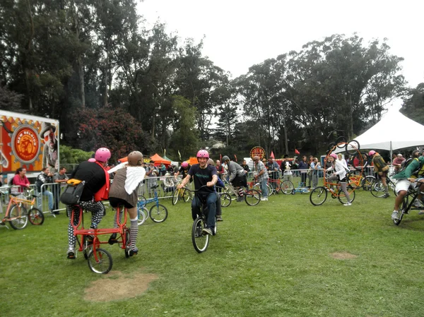 People ride crazy bicycles in circles in celebration of bicyclin
