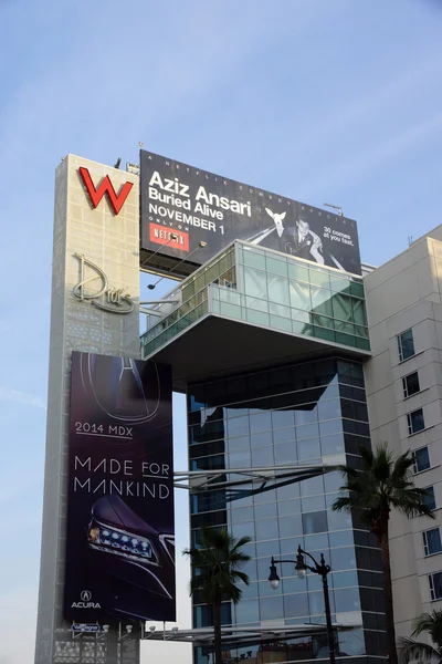 Big Red W and Drais signs with ads for Aziz Ansariand Acura on t