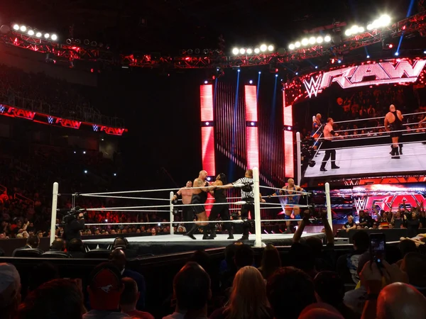 WWE Wrestler Big Show grabs Roman Reigns with Kane in the corner