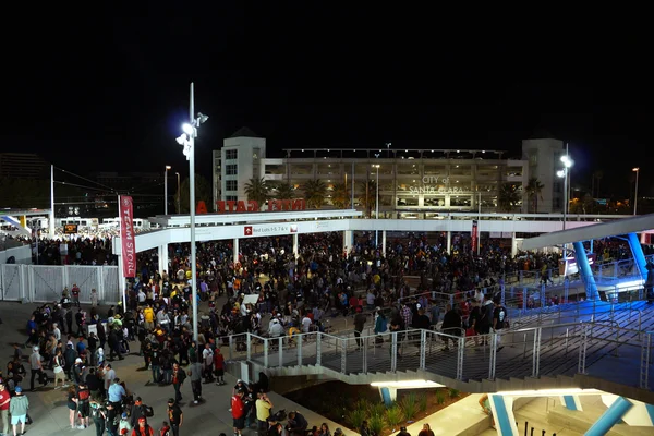 Crowd of people walk down stairs leaving Levi\'s Stadium