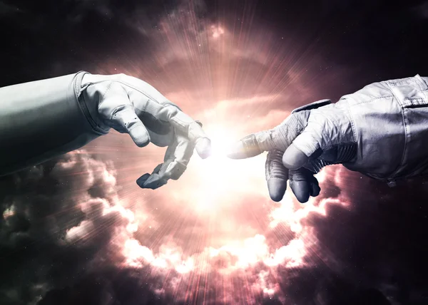 Michelangelo Gods touch. Close up of human hands touching with fingers in space. Elements of this image furnished by NASA