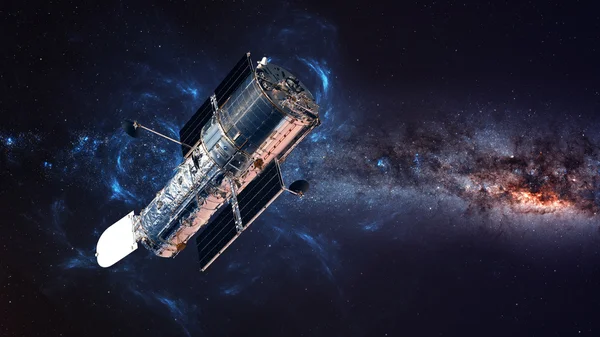 The Hubble Space Telescope in orbit above the Earth. Elements of this image furnished by NASA.