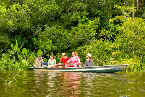 Boat With Tourists In Amazonian Jungle