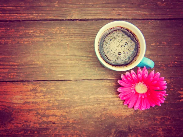 Cup of coffee and flower