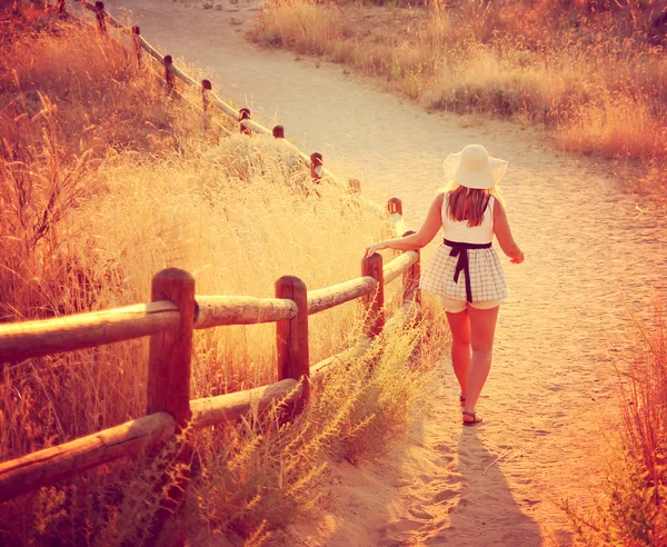 Woman walking on path