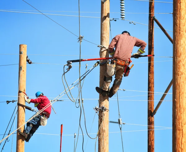 Electrical linemen working