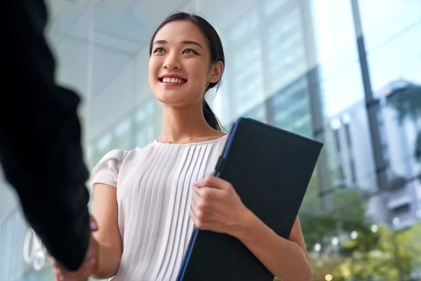 Asian business woman handshake