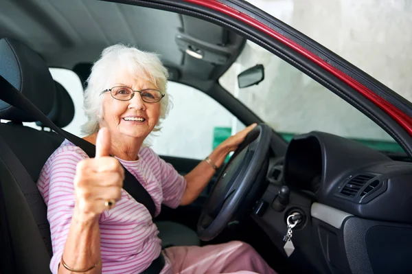 Older woman sitting in a car