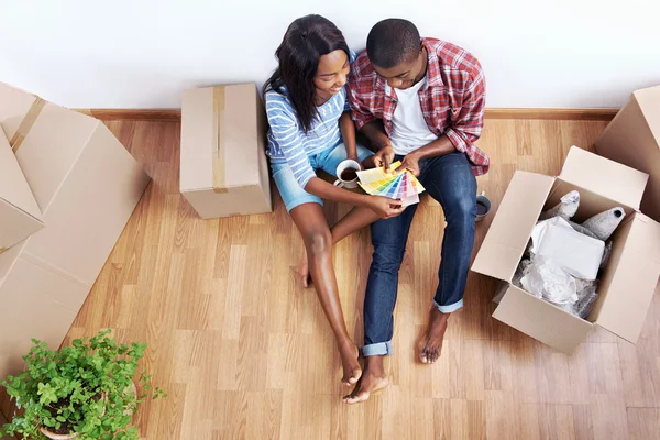 Couple with moving boxes in new apartment