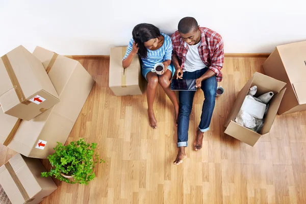 Couple with moving boxes in new apartment